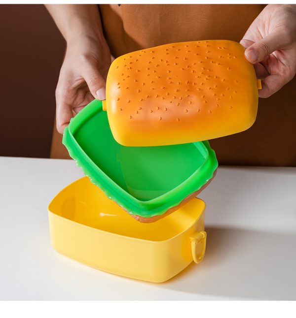Lunchbox in de vorm van een hamburger, met meerdere lagen, ideaal voor het meenemen van diverse snacks.
