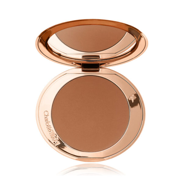 Open bronzer met spiegel in gouden compactetui, ideaal voor een stralende en egale teint.