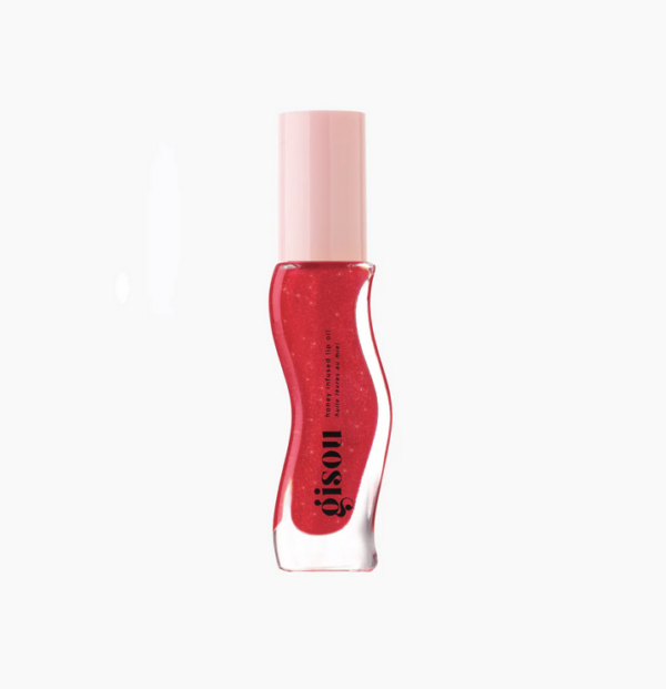 Rode lipolie in elegante fles met roze dop, perfect voor lipverzorging en glans.