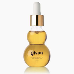 Gouden Gisou gezichtsolie flesje met honingextract en pipet, voor een stralende huidverzorging.