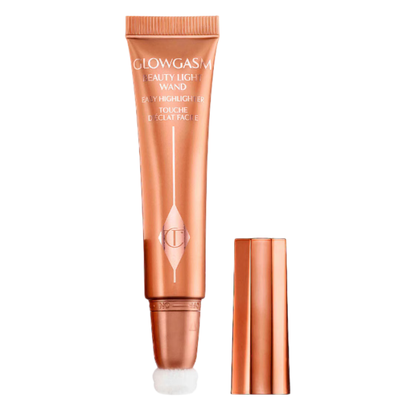 Glowy perzik highlighter tube met dop, perfect voor een stralende huid. Ideaal voor make-up liefhebbers.
