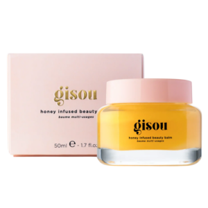 Gisou honing beautybalsem, 50ml, in een stijlvolle pot met roze deksel naast een elegante verpakking.