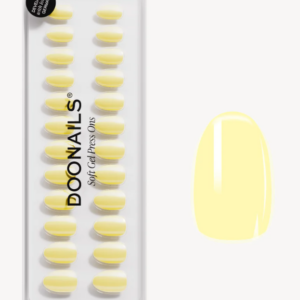 Set van gele soft gel press-on nagels van Doonails met glanzende afwerking. Eenvoudig aan te brengen voor een stijlvolle look.