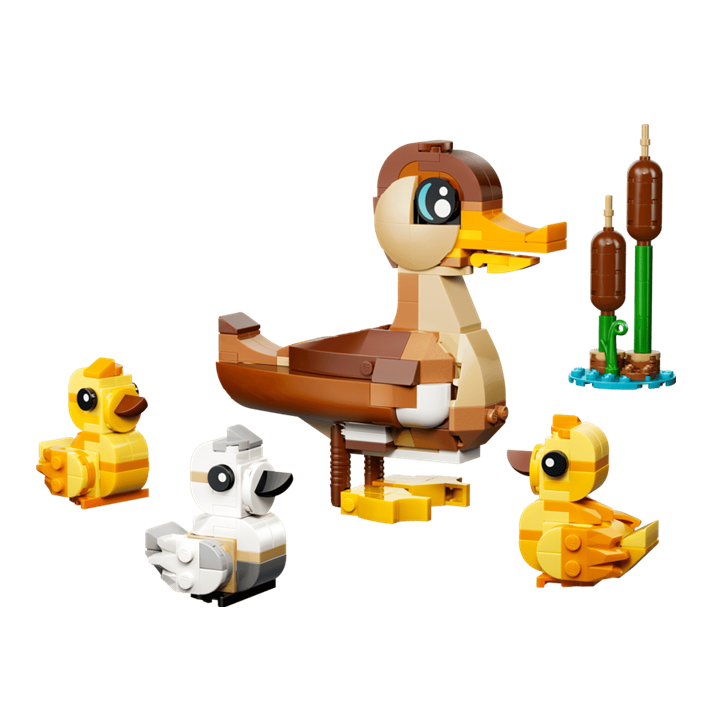 Alt-tekst: Kleurrijke LEGO-constructie van een eend met drie kuikens en waterplanten, perfect voor kinderen en creatieve bouwers.