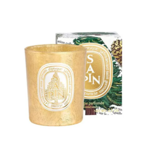 Gouden geurkaars Sapin van Diptyque met elegante verpakking, perfect voor sfeervolle momenten in huis.