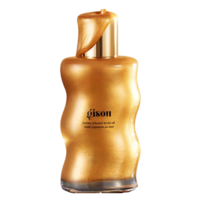 Gisou Honey Infused Body Oil in een gouden fles, perfect voor hydratatie en een stralende huid.