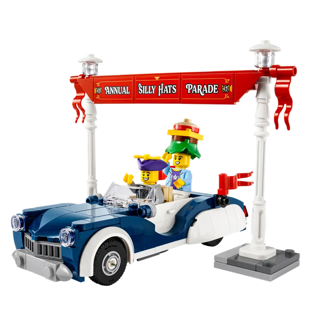 LEGO-figuren in een auto tijdens de Annual Silly Hats Parade, met een kleurrijke hoed en versieringen.