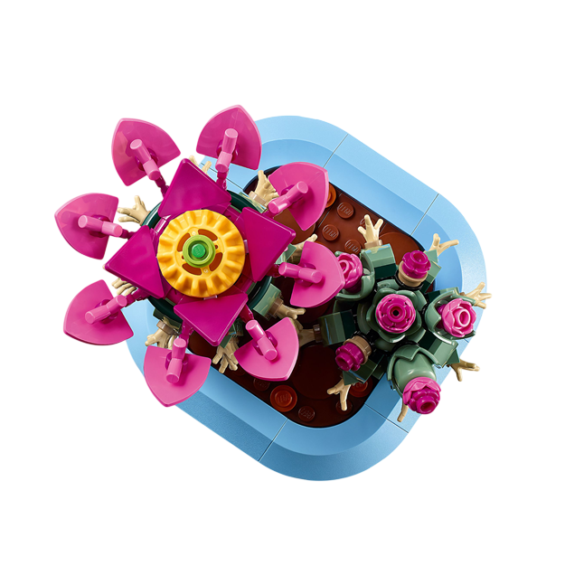 Kleurige bloempot met speelse bloemenconstructie in roze en groen, ideaal voor creatieve LEGO-projecten.
