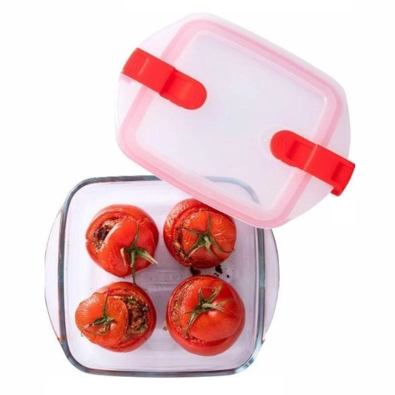 Gevulde tomaten in glazen bewaardoos met een roze deksel. Perfect voor een gezonde maaltijd of leftovers.